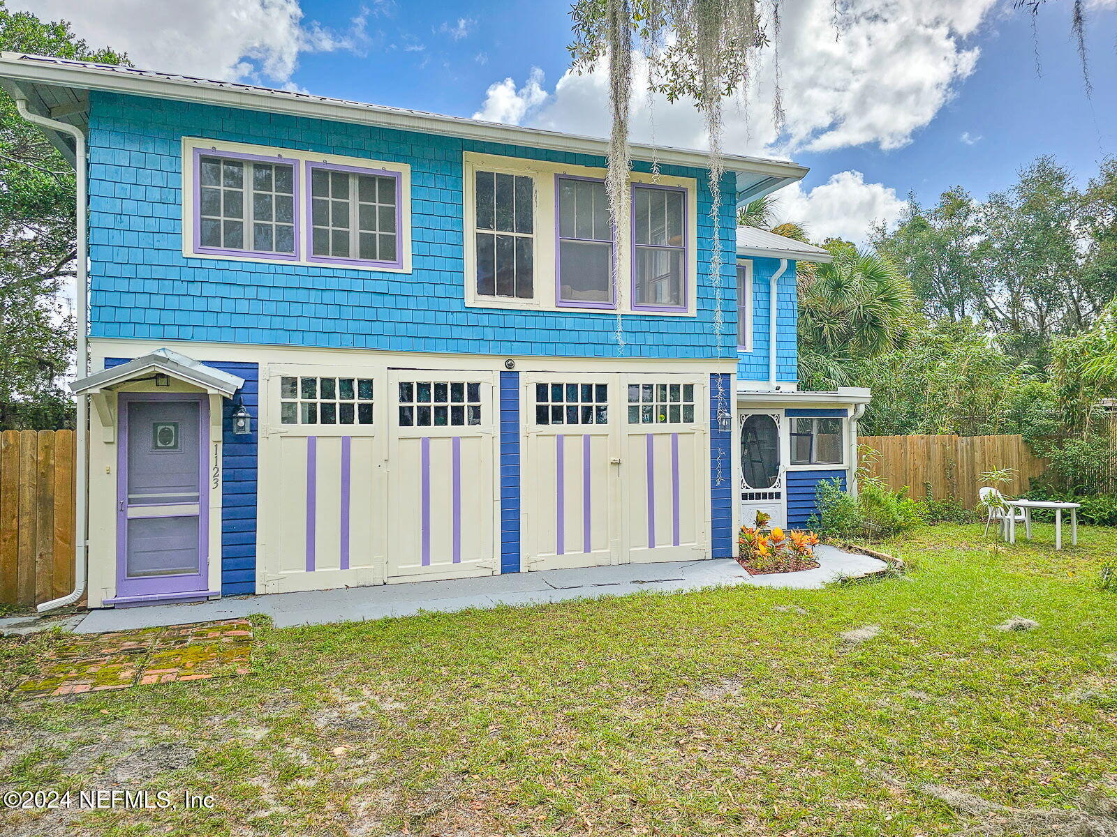 a view of a house with backyard porch and sitting area