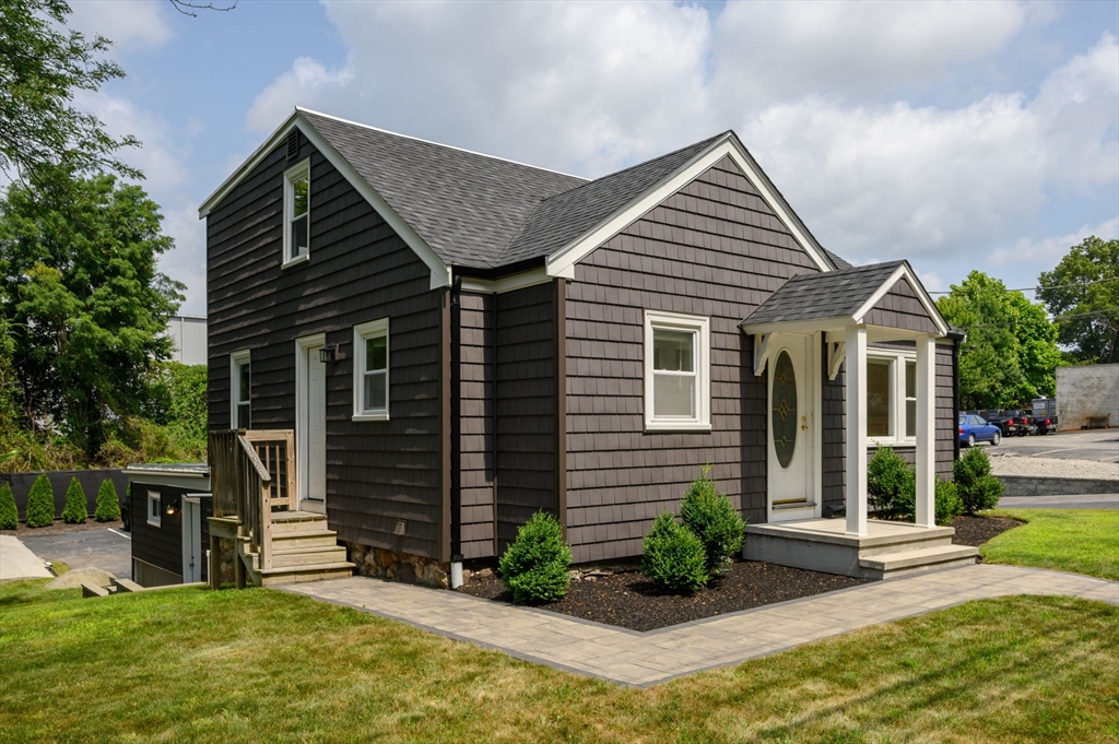 a front view of a house with garden