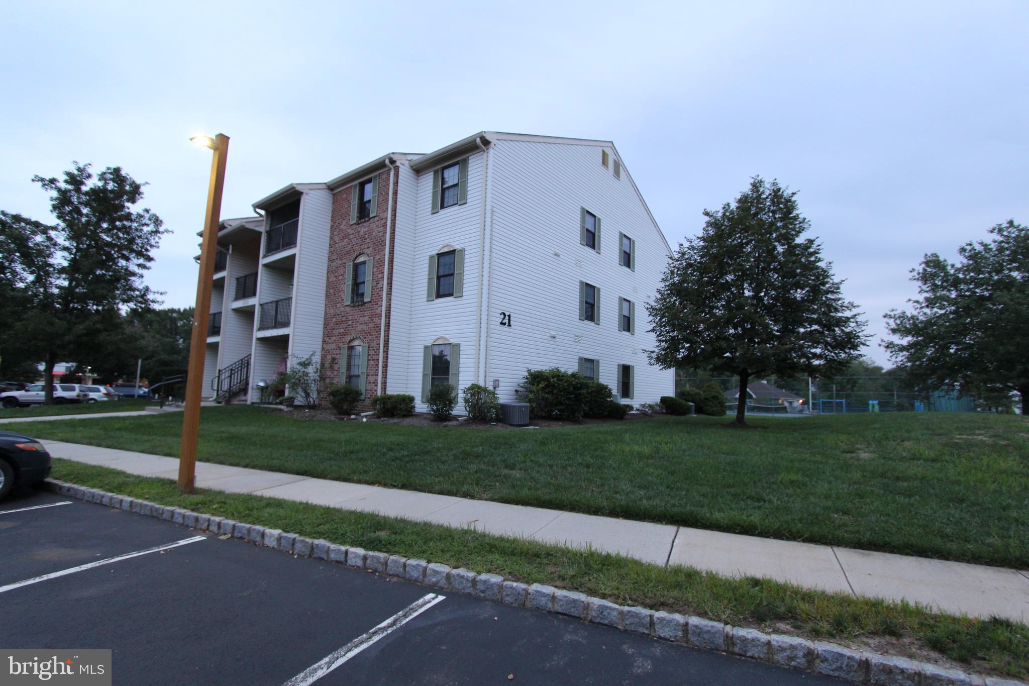 a view of a white building among the street side