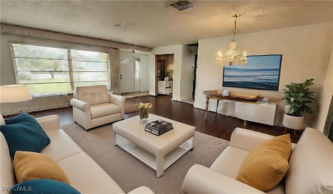 a living room with furniture ceiling fan and a window