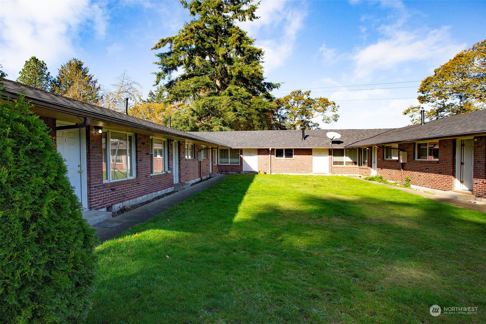 a view of a house with a backyard porch and sitting area