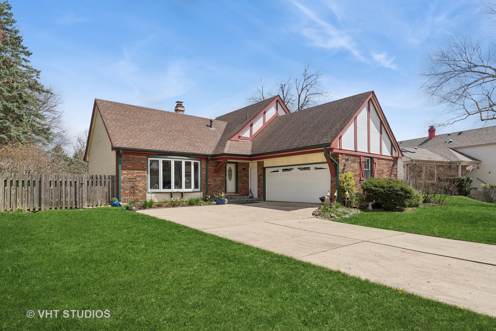 a front view of house with yard and green space