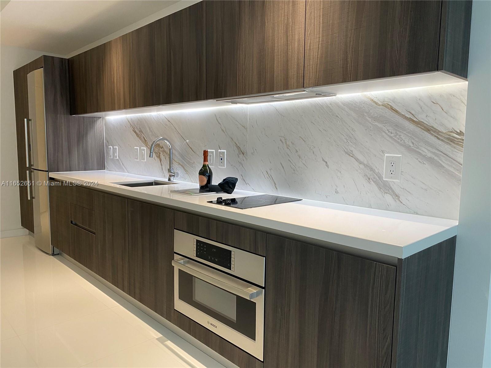 a kitchen with a sink and cabinets