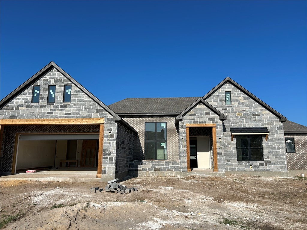 Look at the brick work inset in the garage and ent