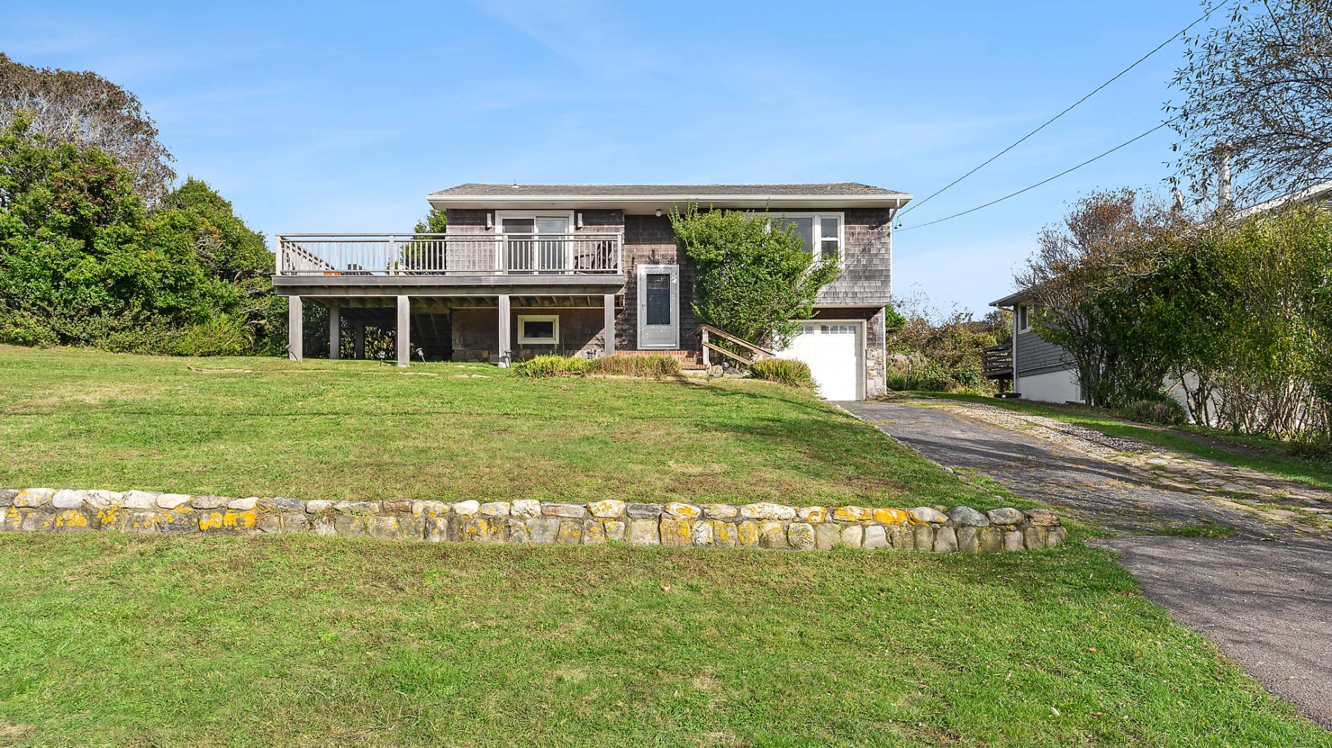 a front view of a house with a garden