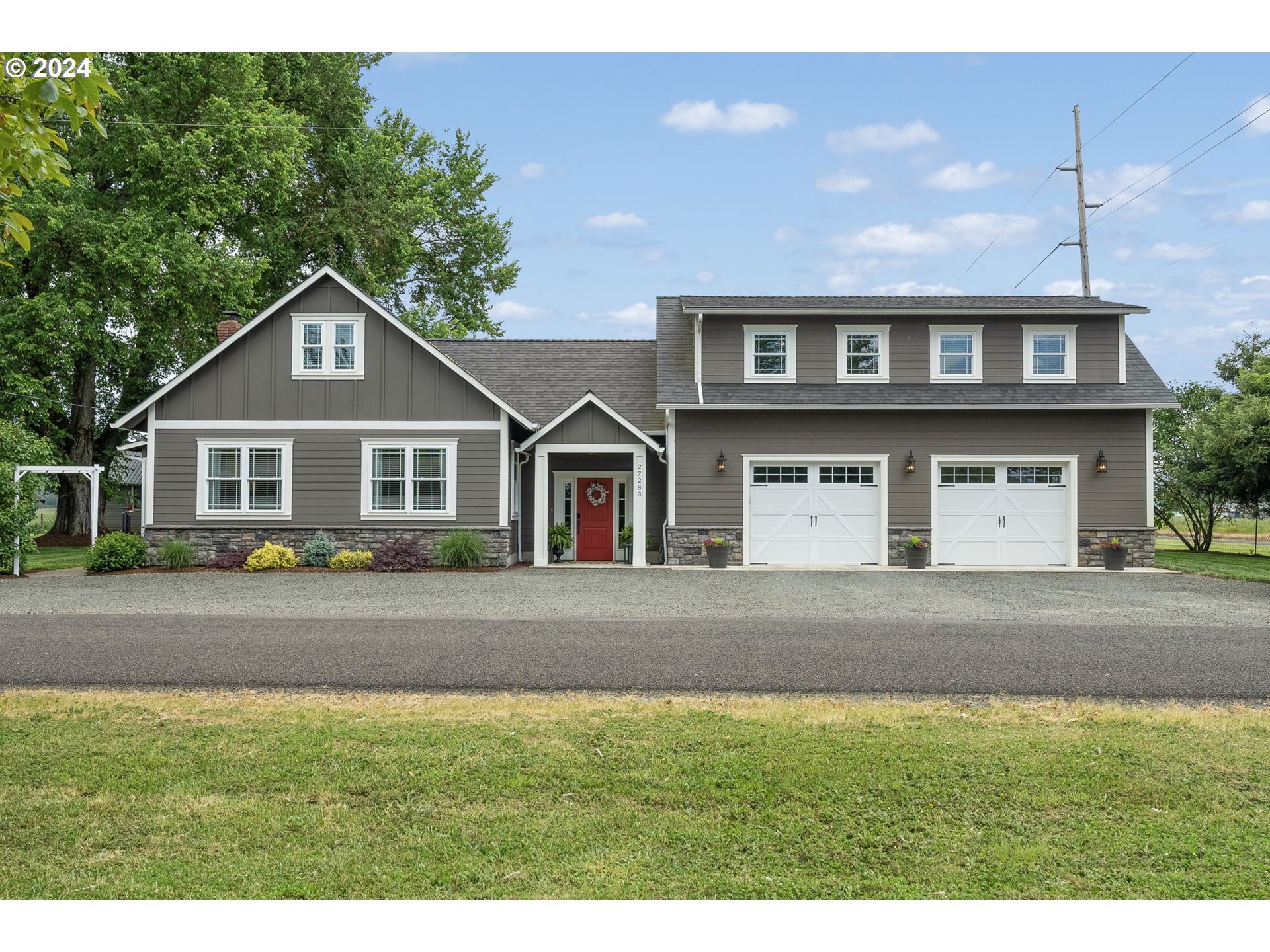 a front view of a house with a yard