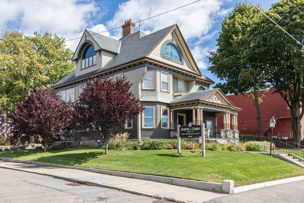 a front view of a house with a yard