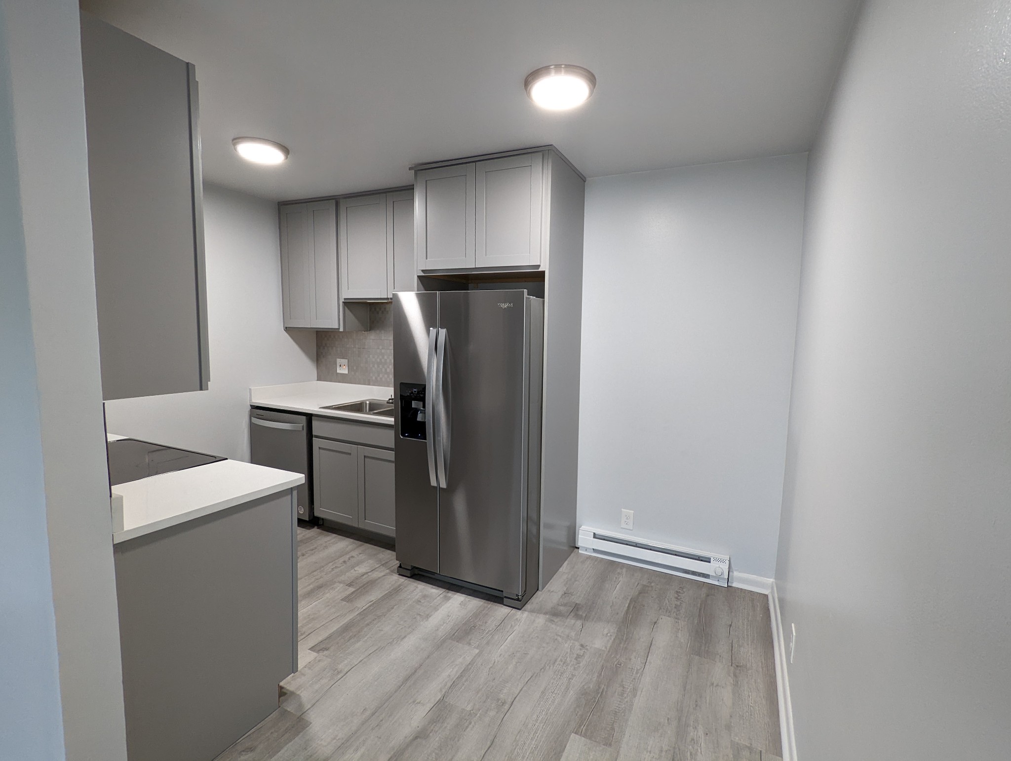 a kitchen with stainless steel appliances a refrigerator and a stove