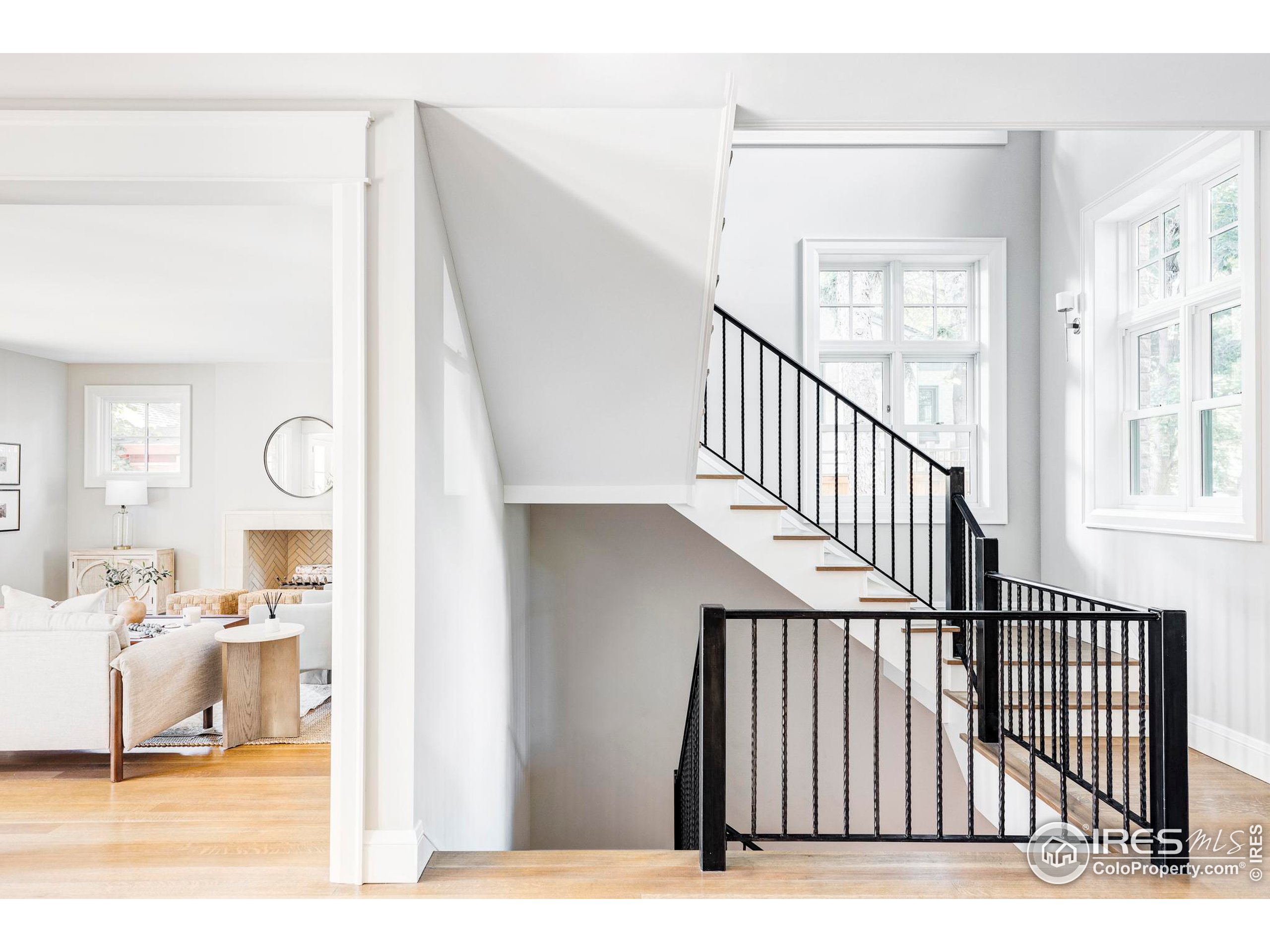 a view of a living room and entryway