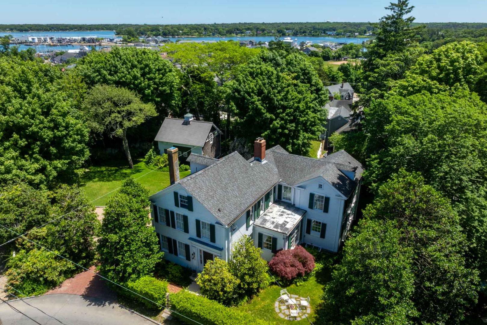 an aerial view of a house with a yard and garden