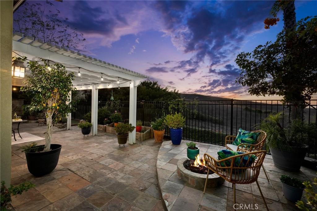 a patio with patio table and chairs