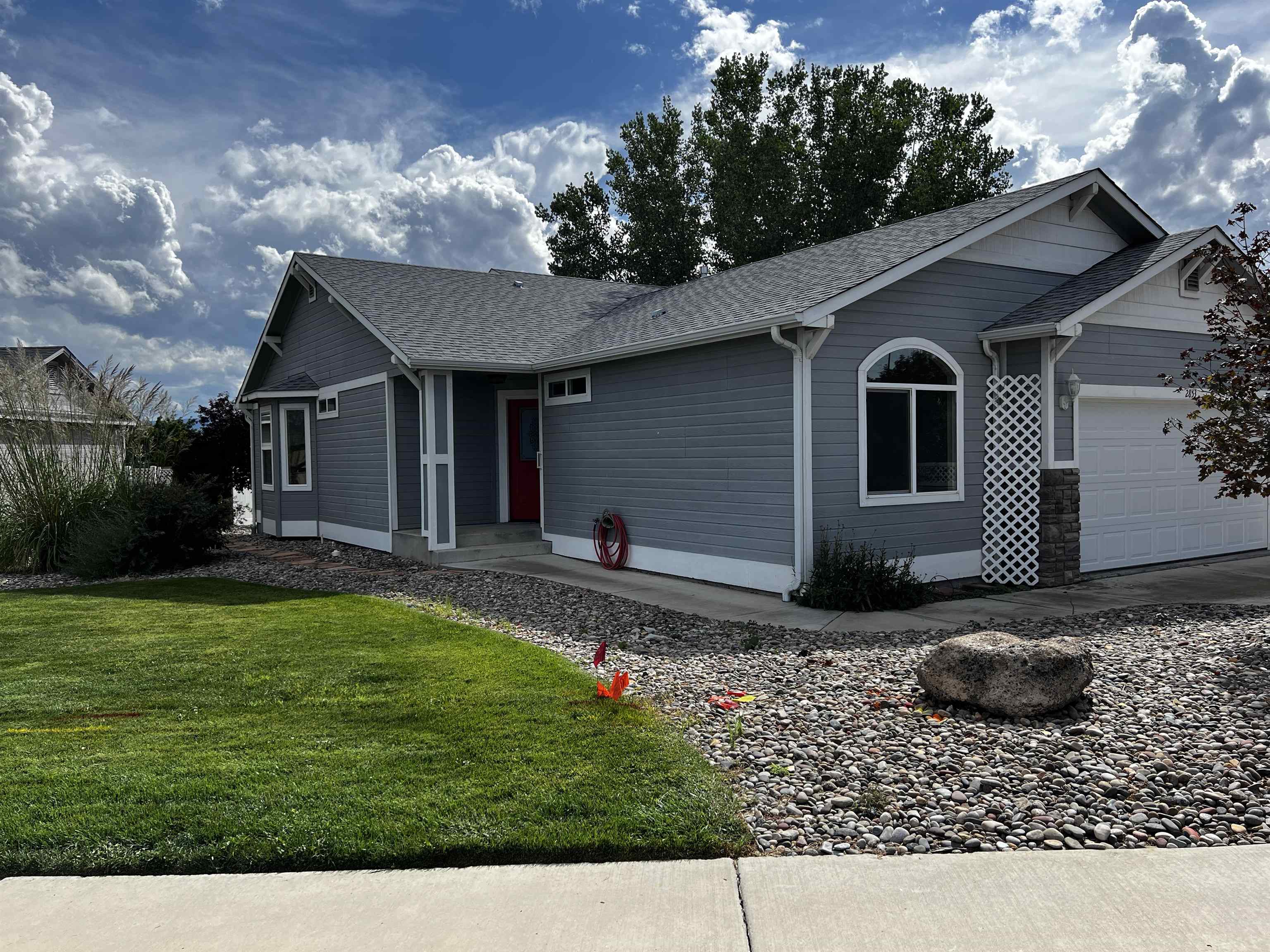 a front view of a house with garden