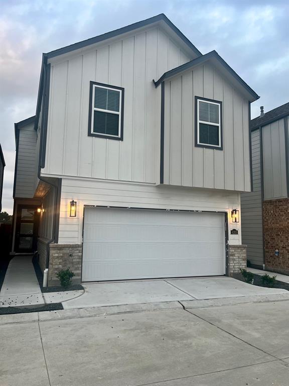 a front view of a house with garage