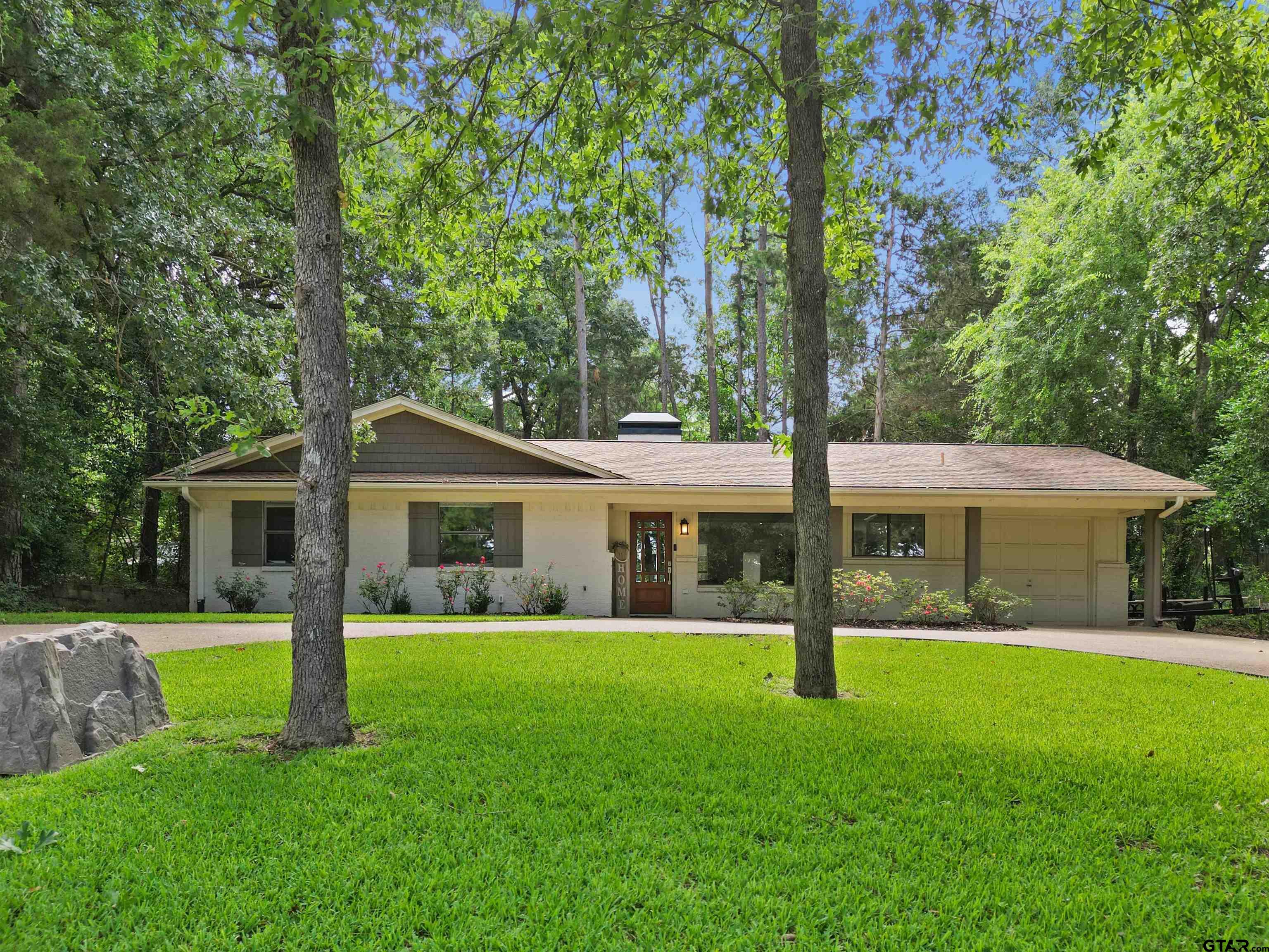 a view of house with a garden