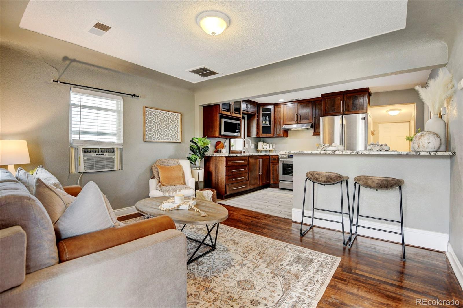 a living room with furniture and a rug