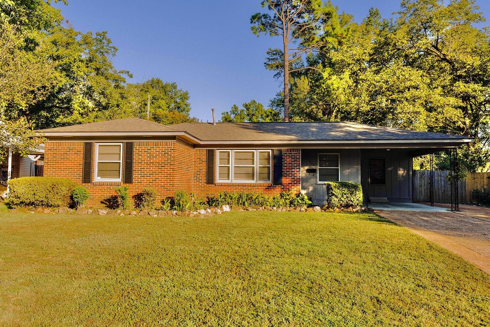 a front view of a house with patio