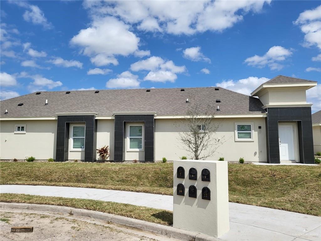 View of front of property with a front lawn