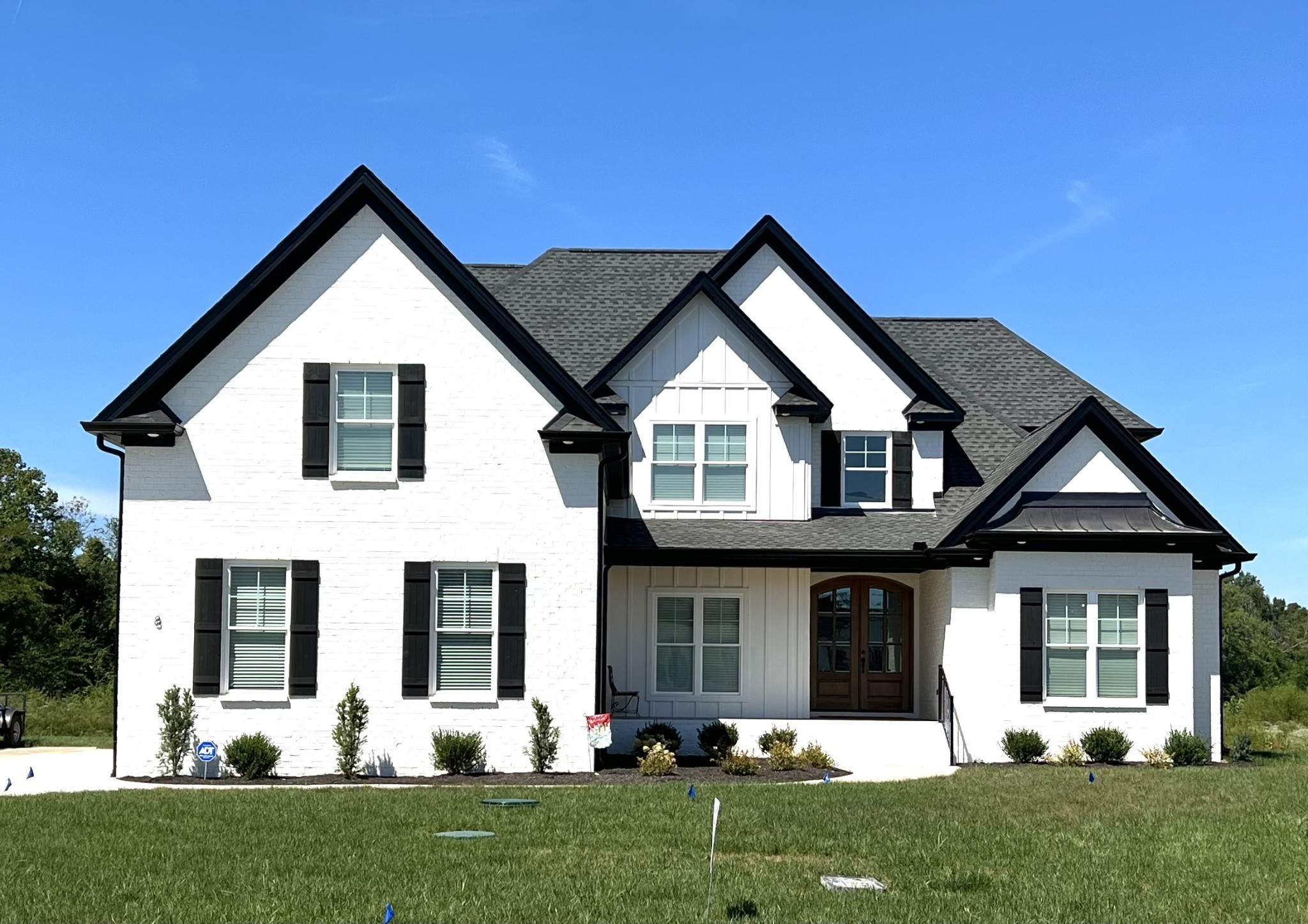 a front view of a house with a yard