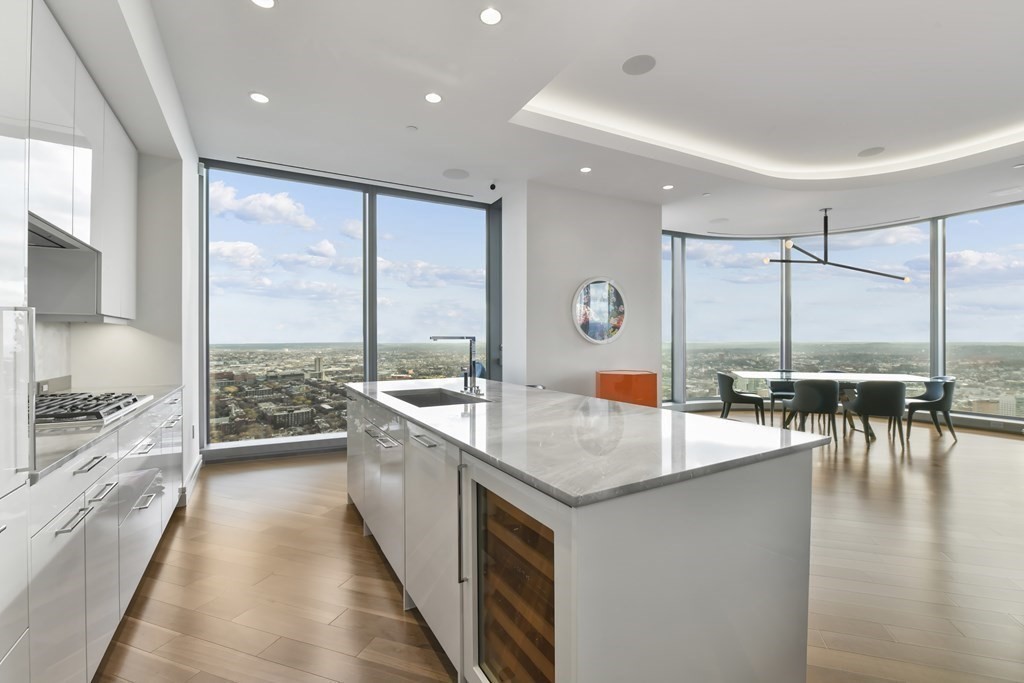 a kitchen with counter top space a sink and appliances