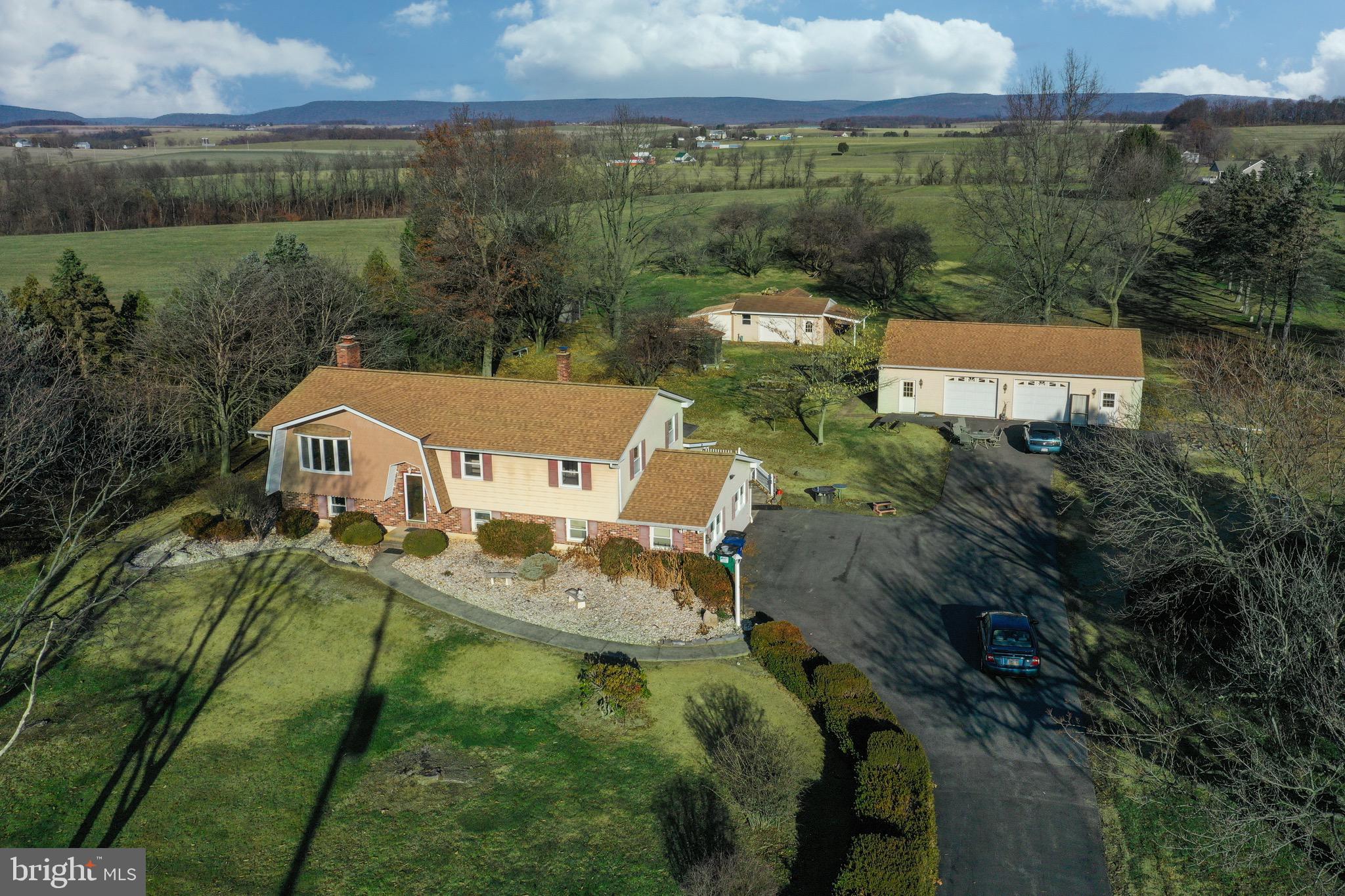 an aerial view of a house with a garden