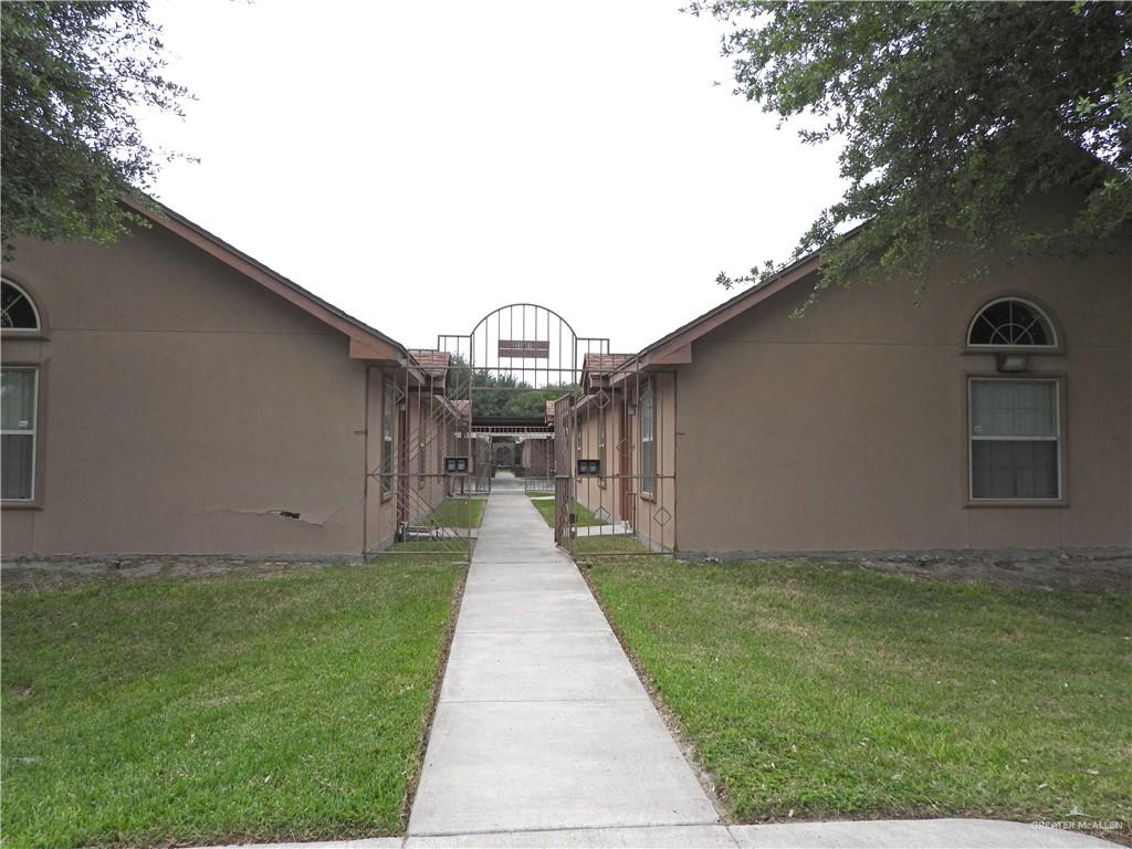 View of property exterior featuring a lawn