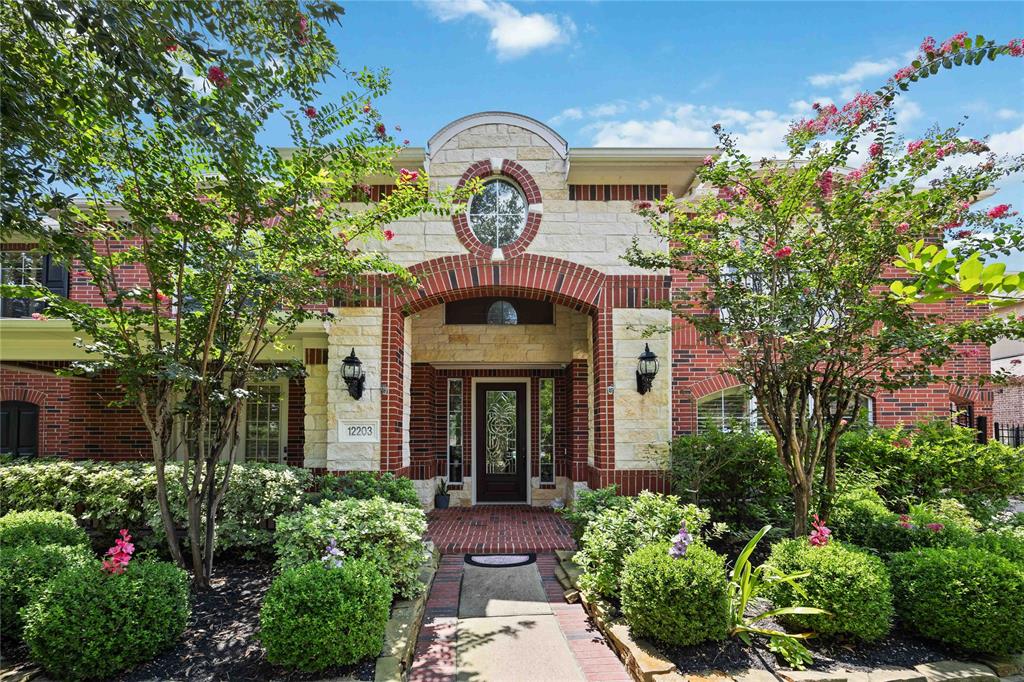 front view of a house with a fountain