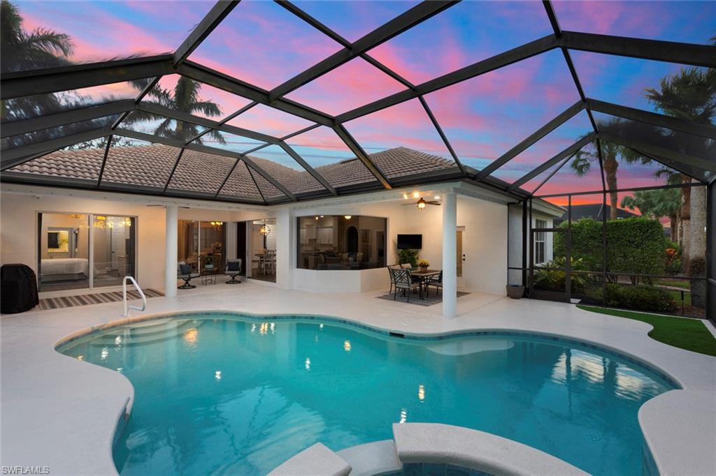 a view of a swimming pool with a patio