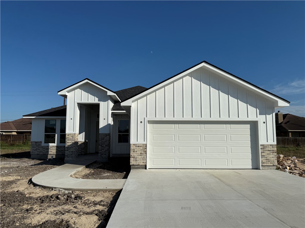 a front view of a house with garage