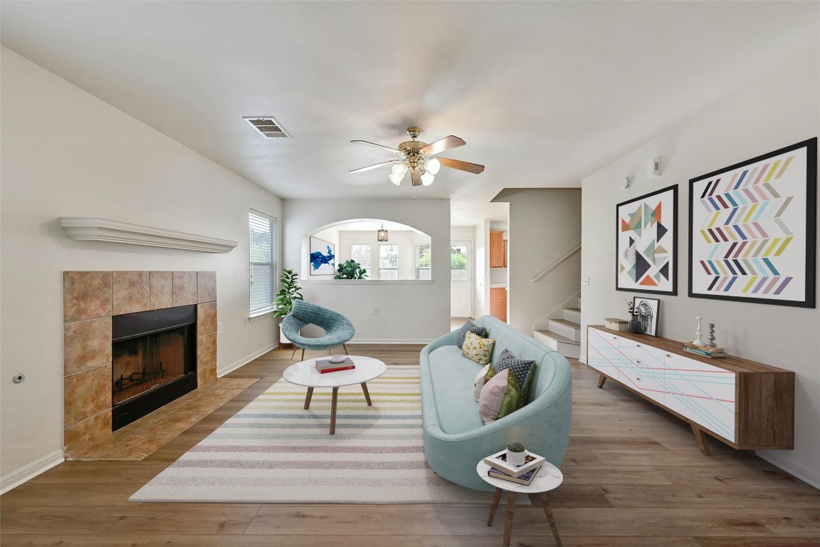 a living room with furniture and a fireplace