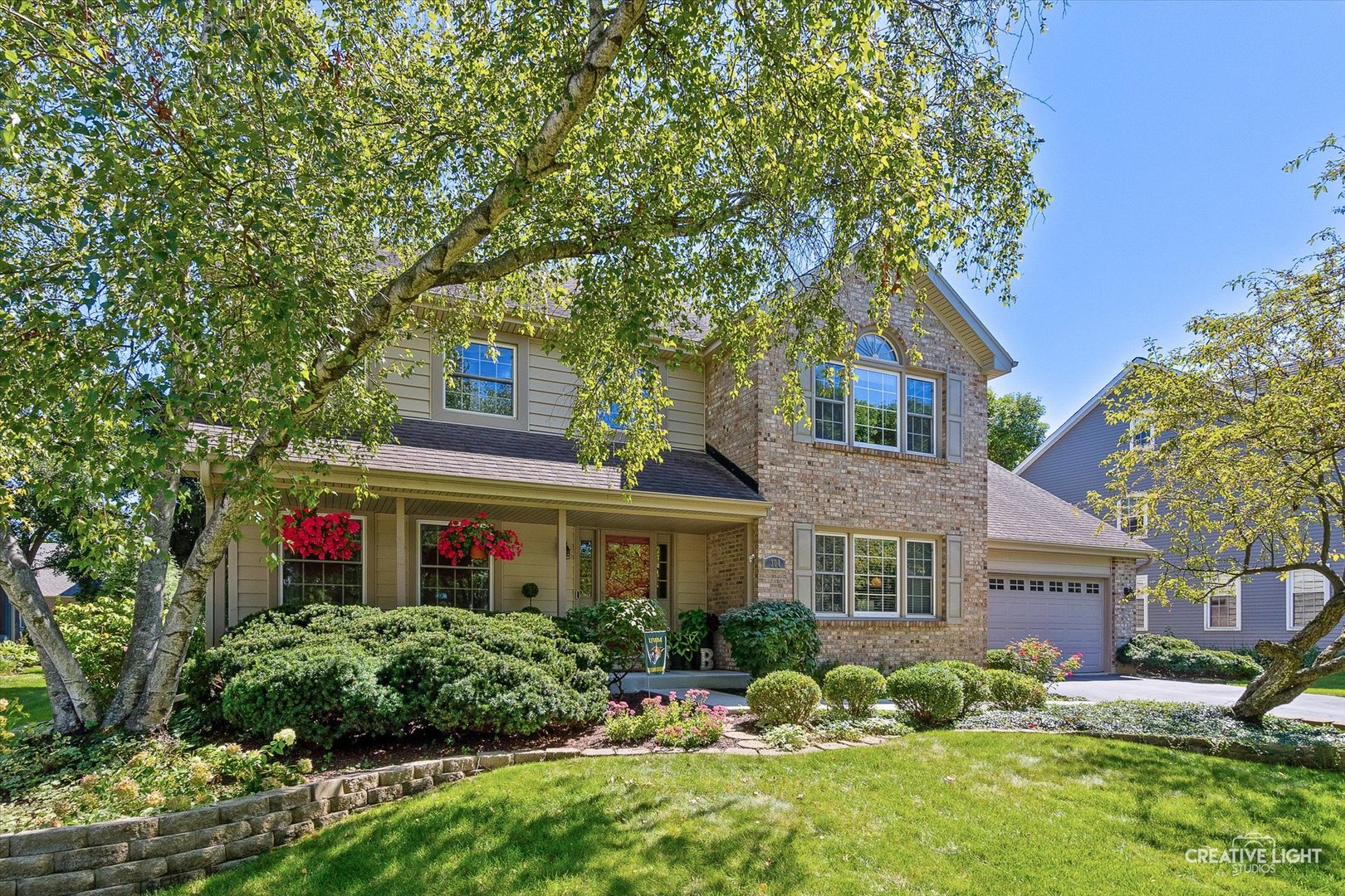 a front view of a house with garden