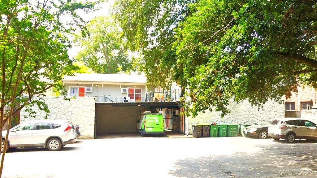 a view of a car park in front of house