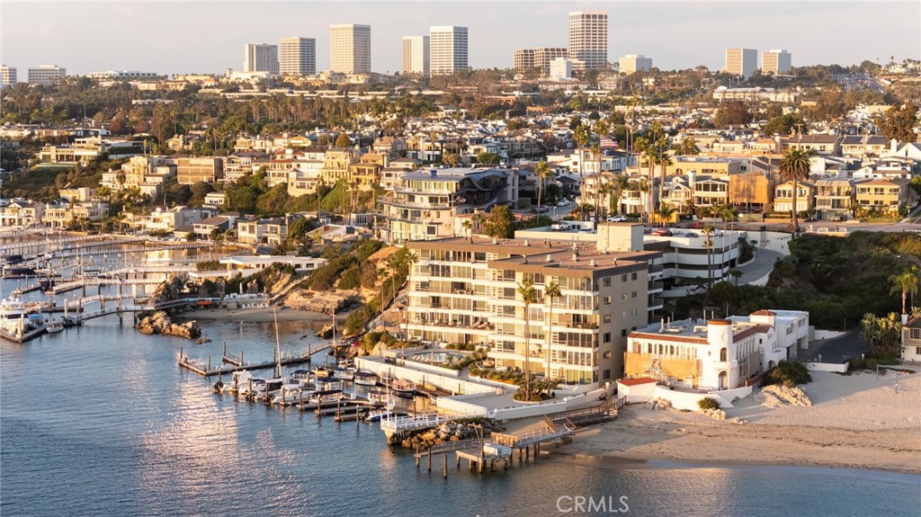 an aerial view of residential building and lake