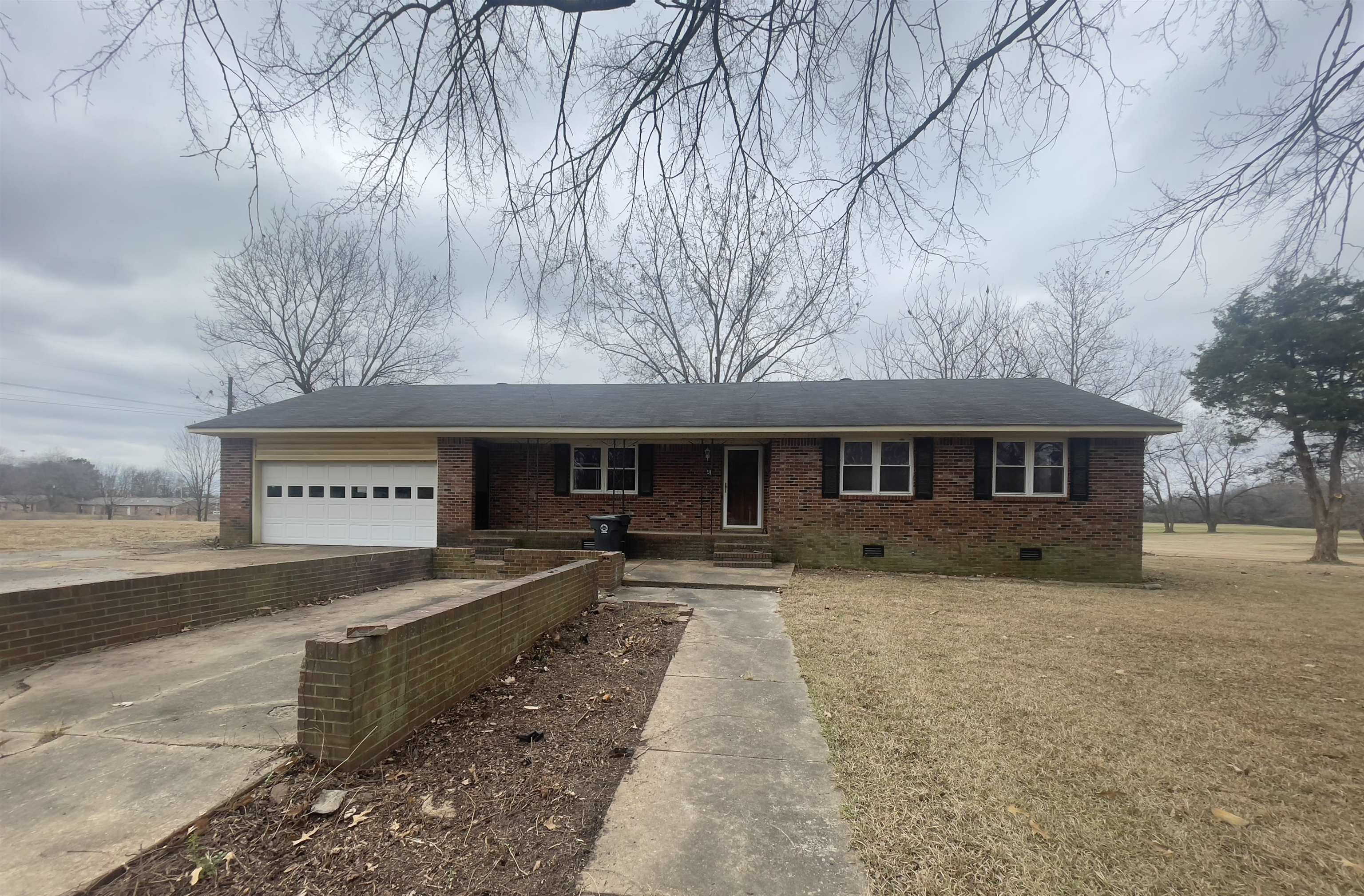 a front view of a house with yard