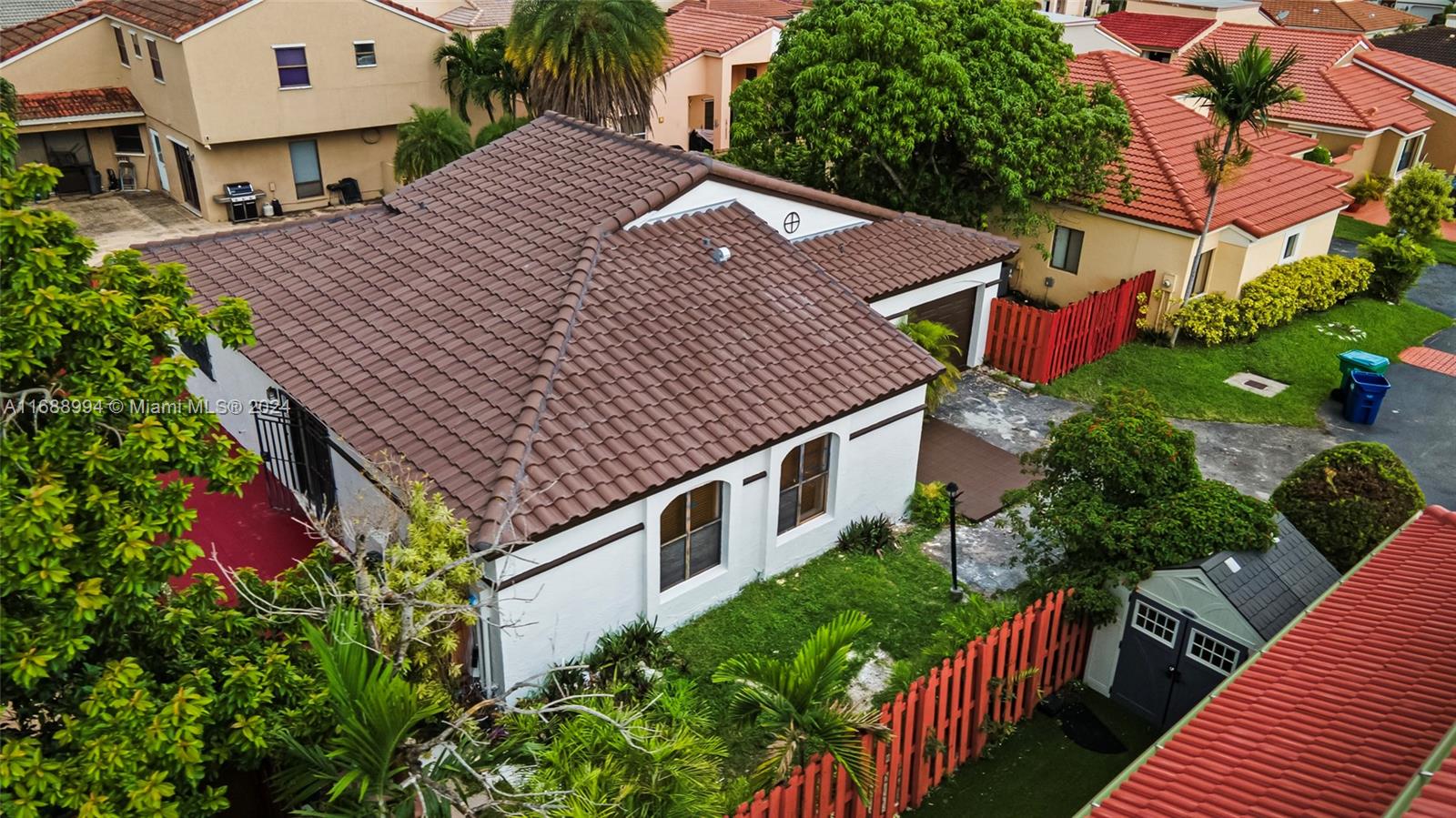 a aerial view of a house with a yard