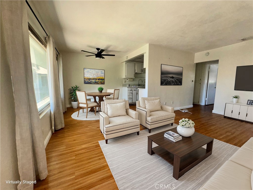 a living room with furniture fireplace and a flat screen tv