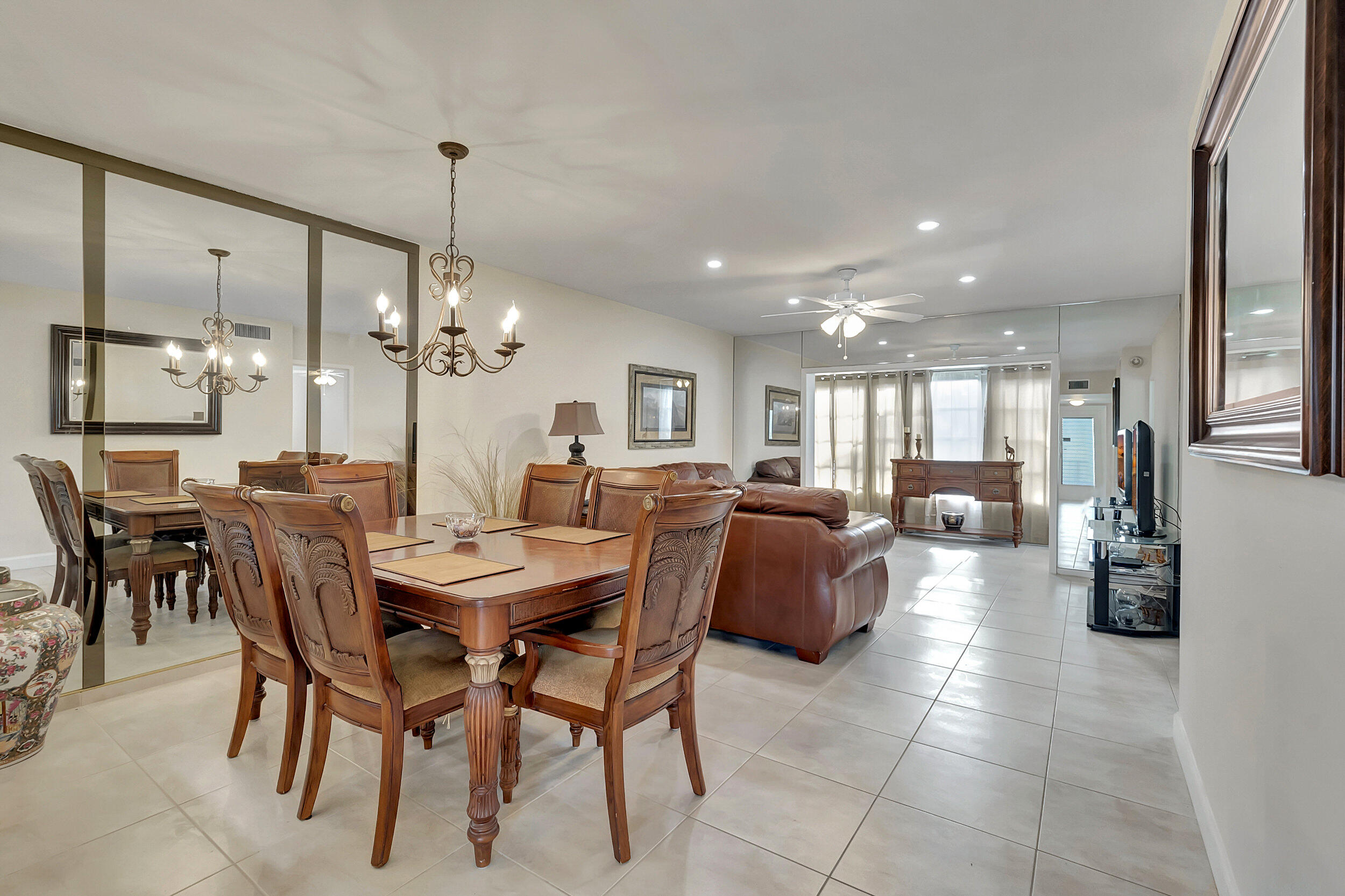 a large kitchen with a table and chairs