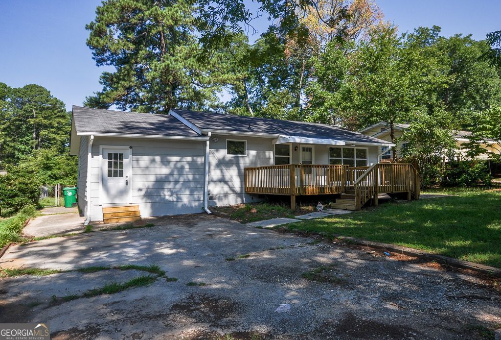 a view of a house with backyard from a garden