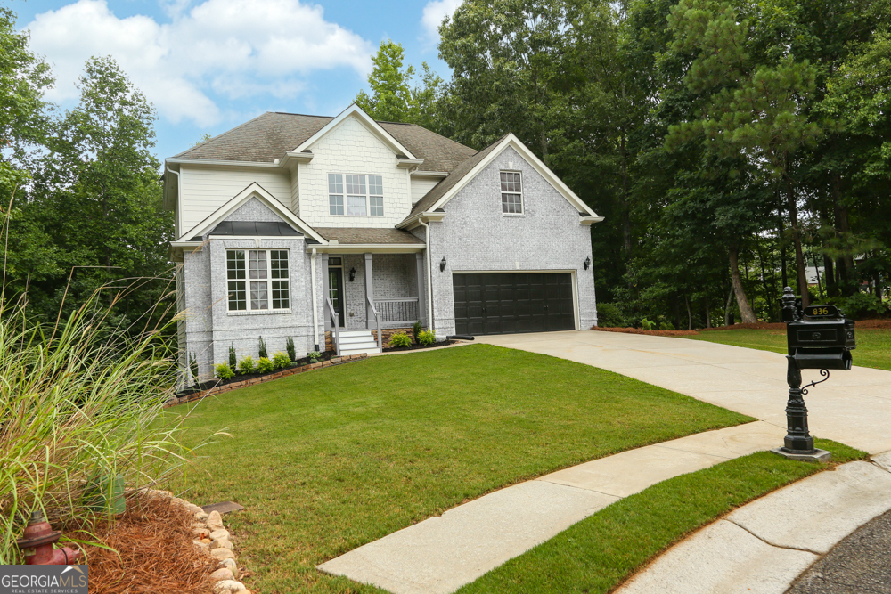 a front view of a house with yard