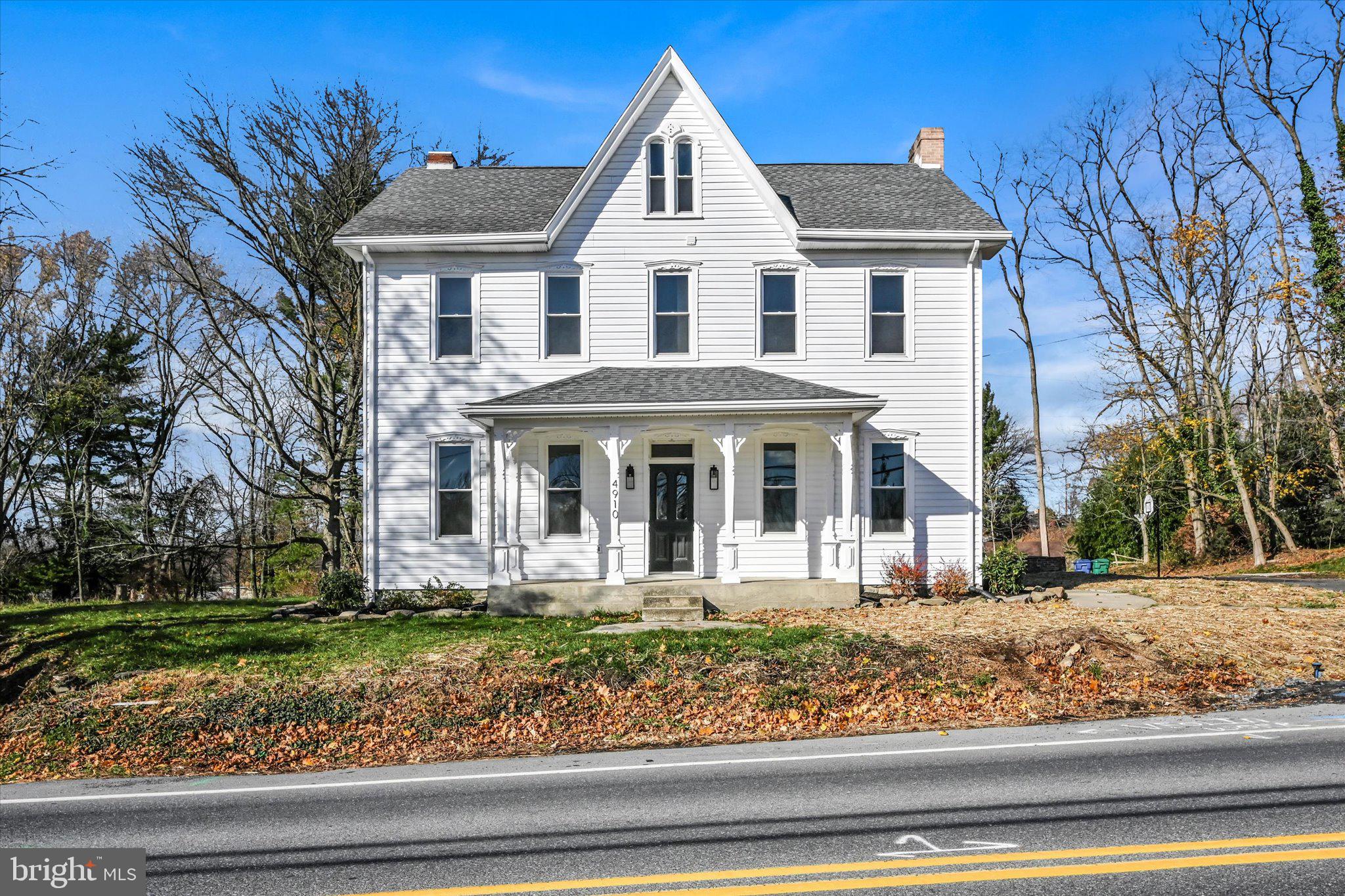 front view of a house with a yard