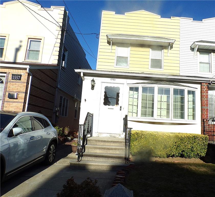 a view of a car parked in front of a house