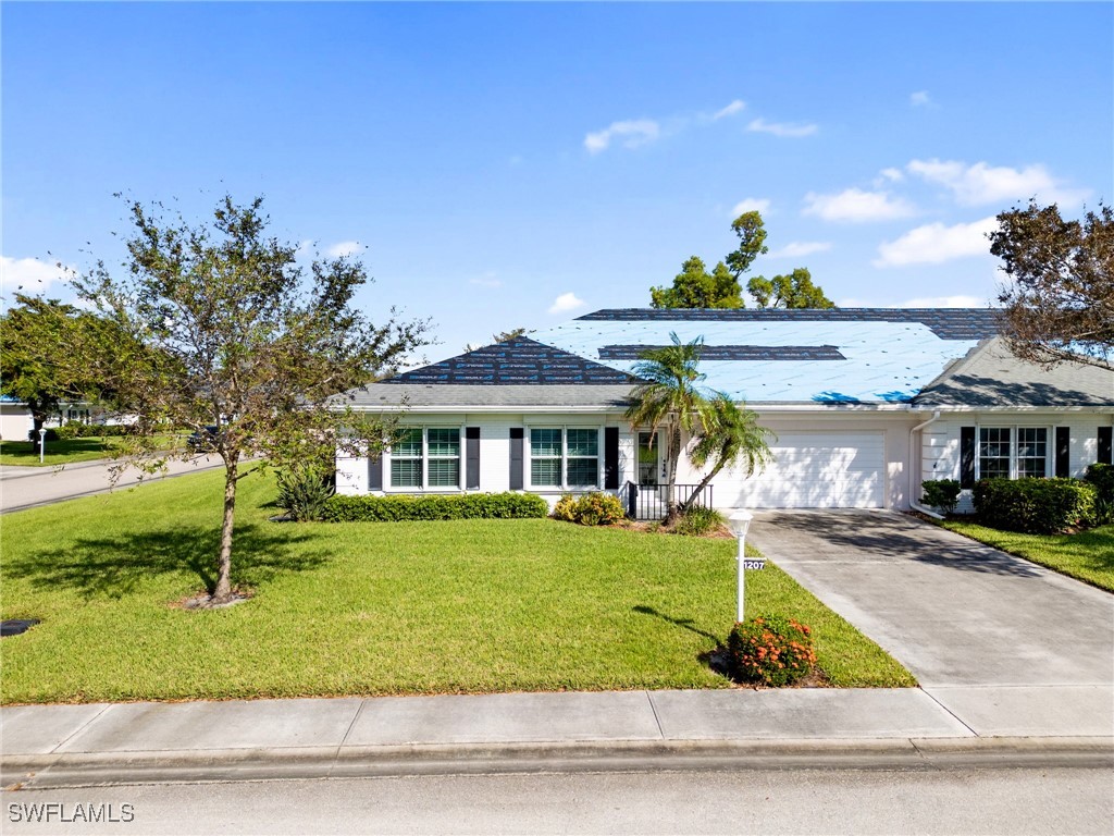 a front view of a house with a yard