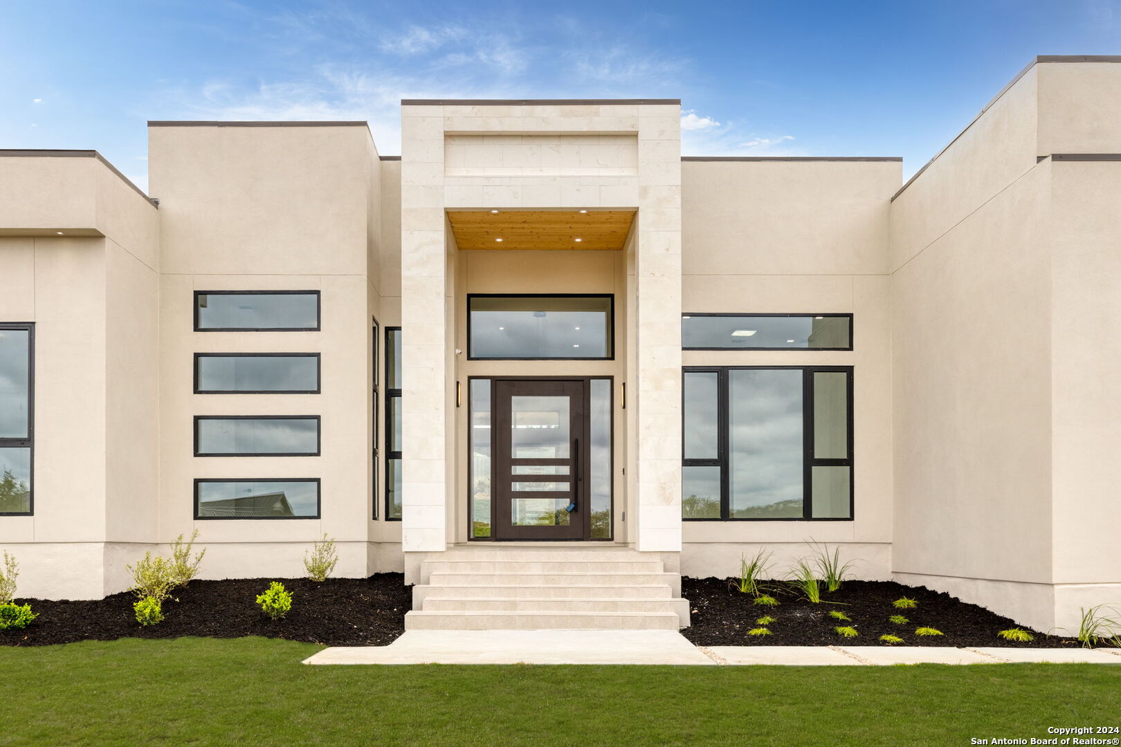 a front view of a house with a yard