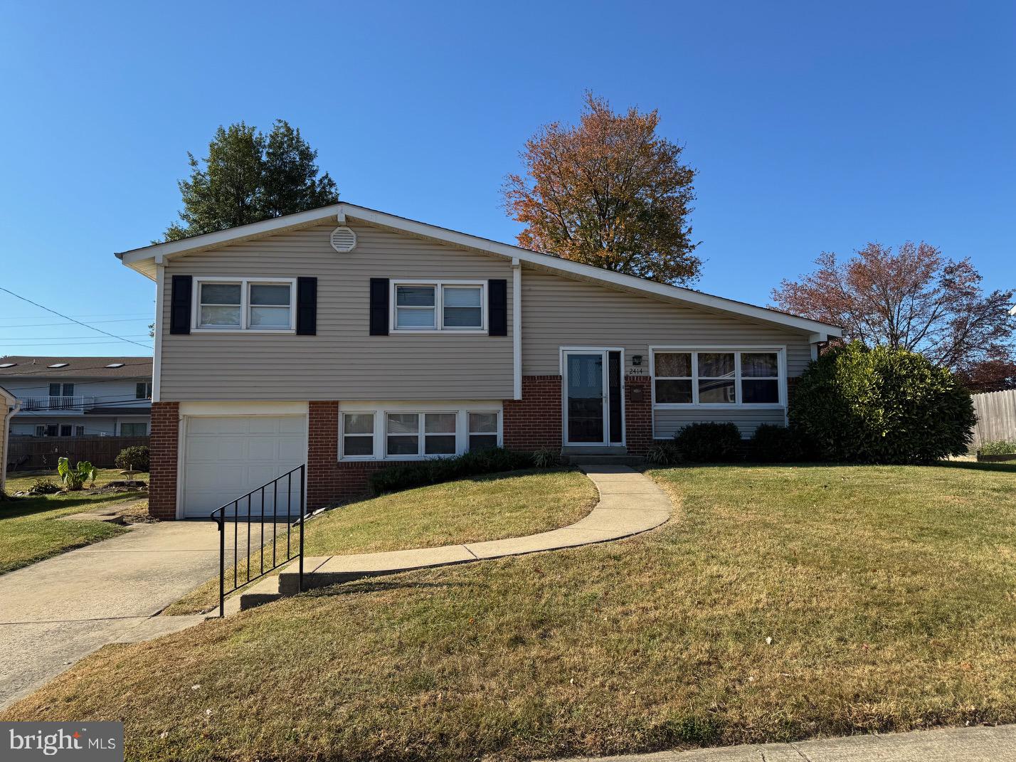 a front view of a house with yard