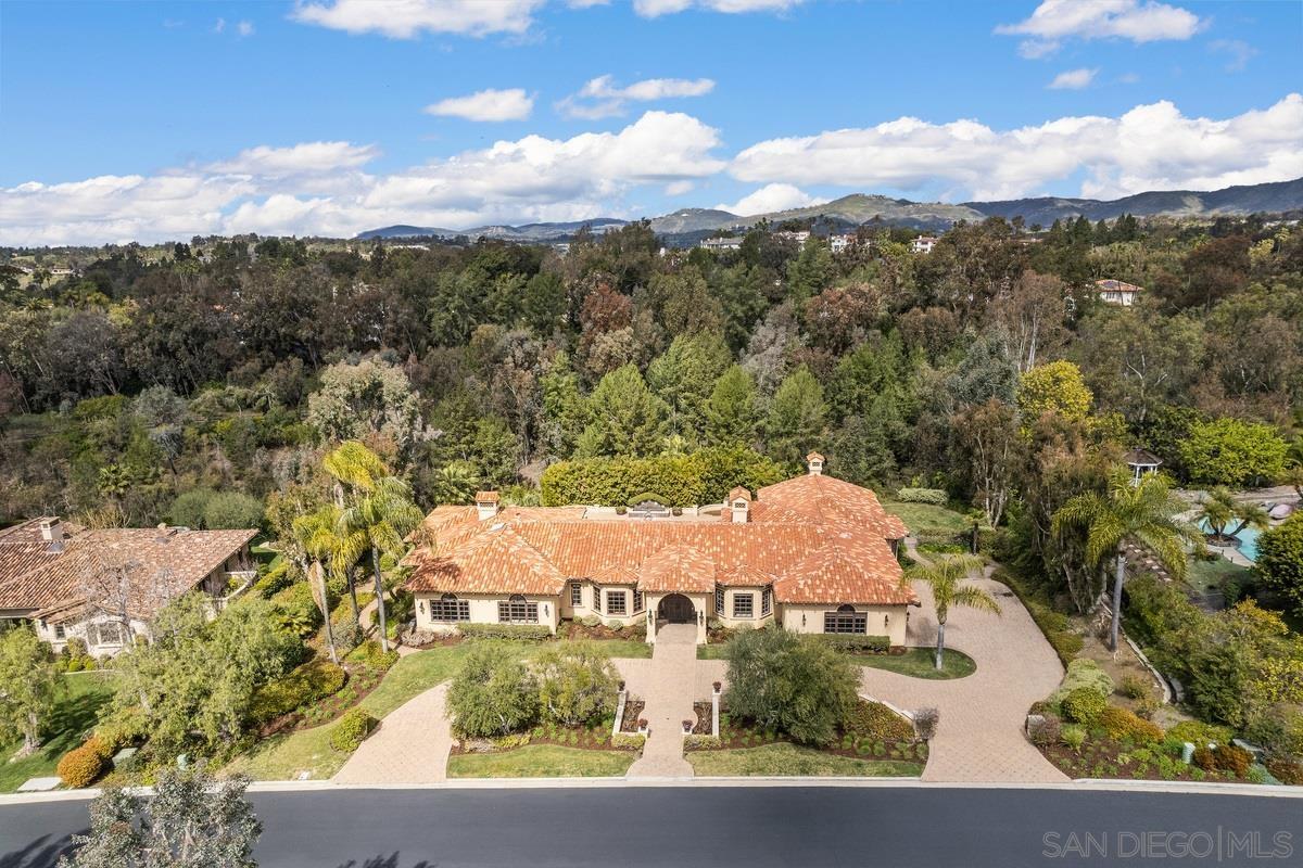 an aerial view of house with yard