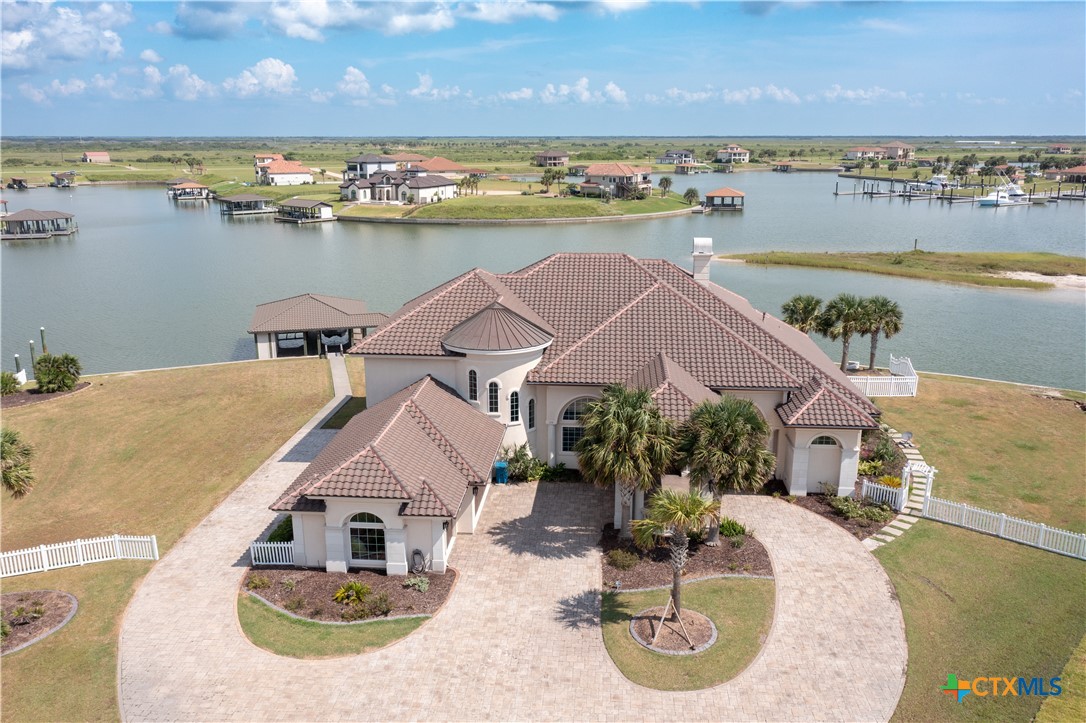 an aerial view of a house with a lake view