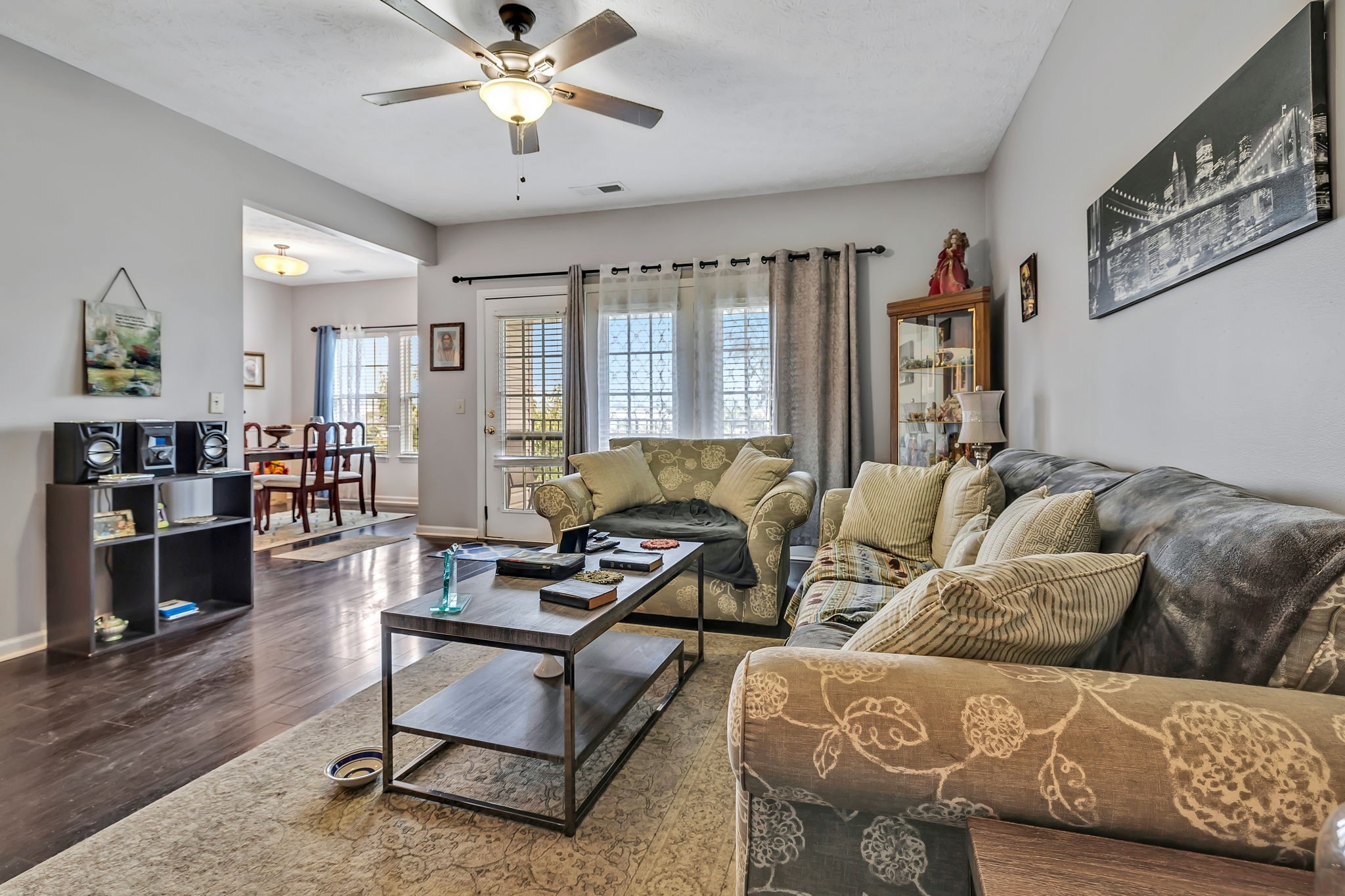 a living room with furniture and a fireplace