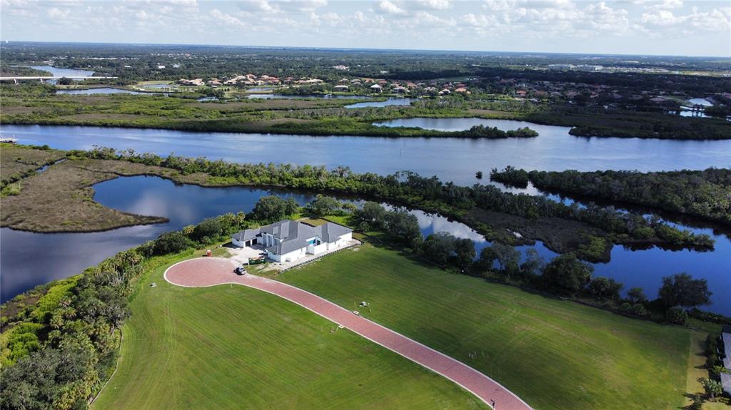 an aerial view of a house with a lake view