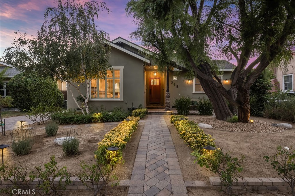 a house with garden in front of it