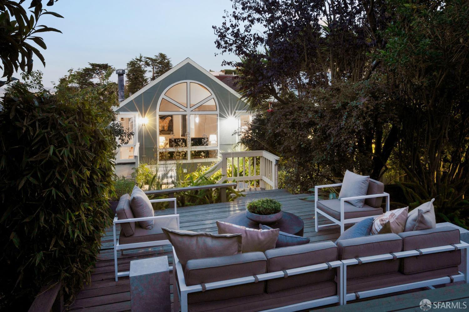 a view of house with outdoor seating and city view