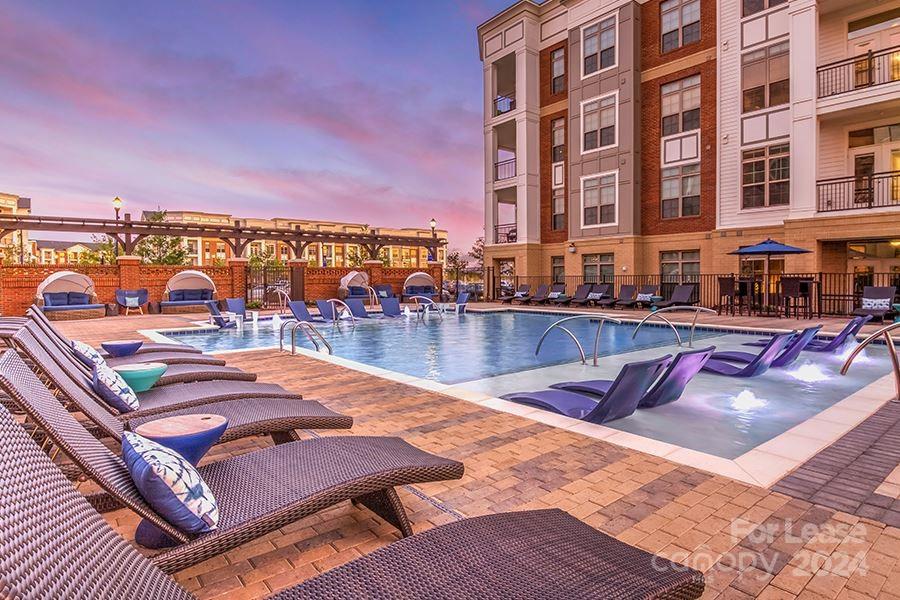 a view of a swimming pool with a lounge chairs